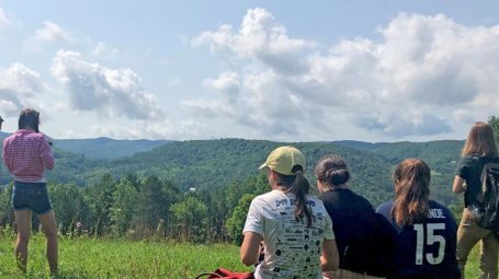 group of high school students looking at view from King Farm in Woodstock Vermont