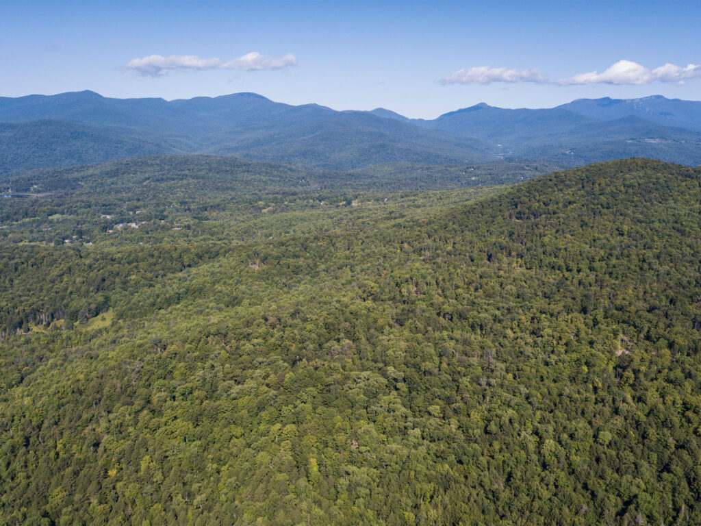 aerial photo of densely forested hills. Waterbury and Stowe Vermont